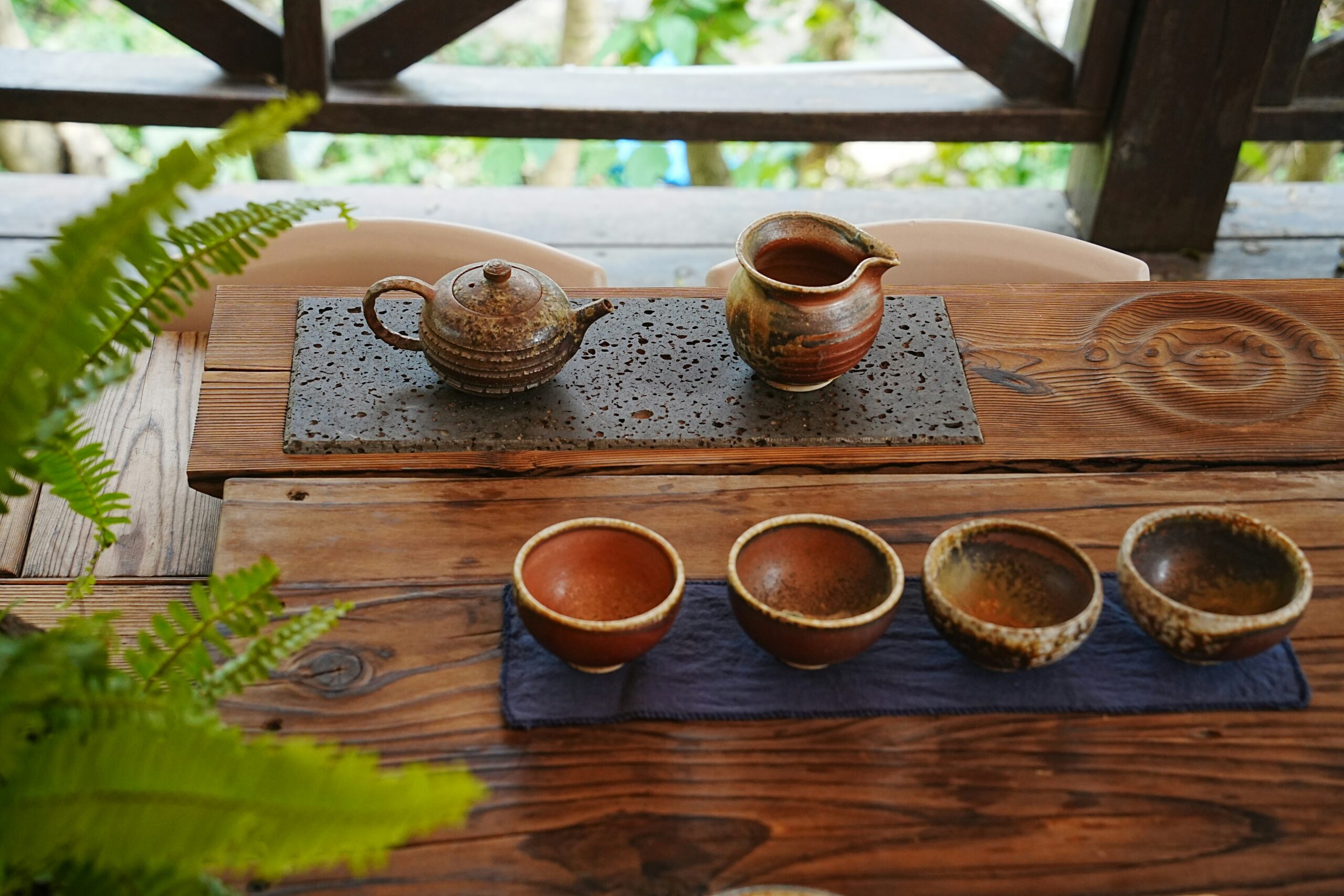 Concept shoot of various herbal tea ingredients and coffee beans on a wooden table giving a natural vibe