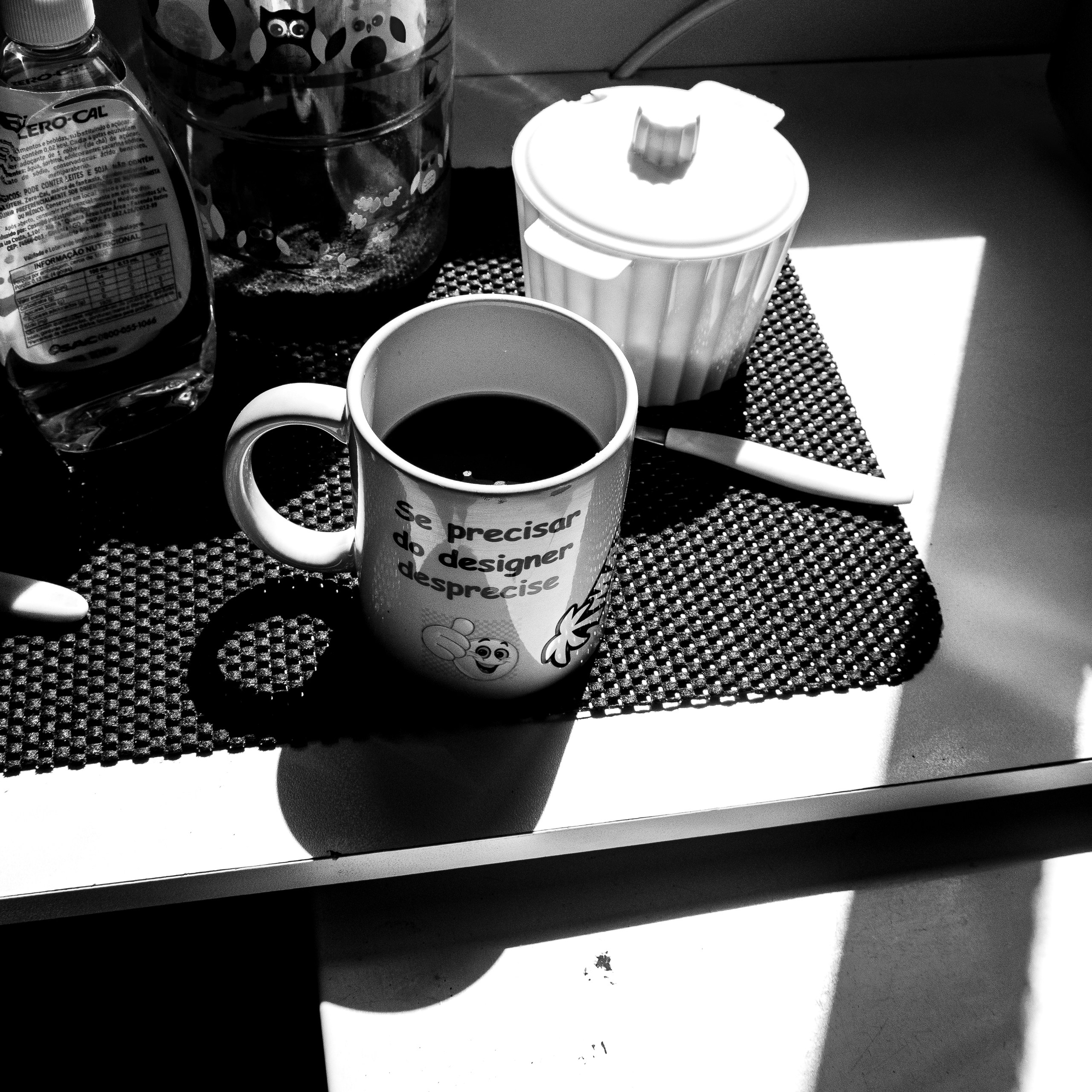 Healthy breakfast setup with a cup of black coffee and a bottle of water