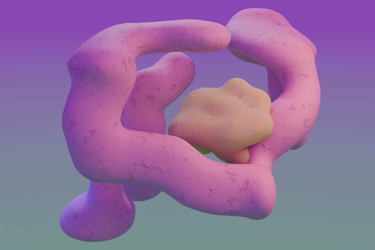 A close up of a pink object on a purple background