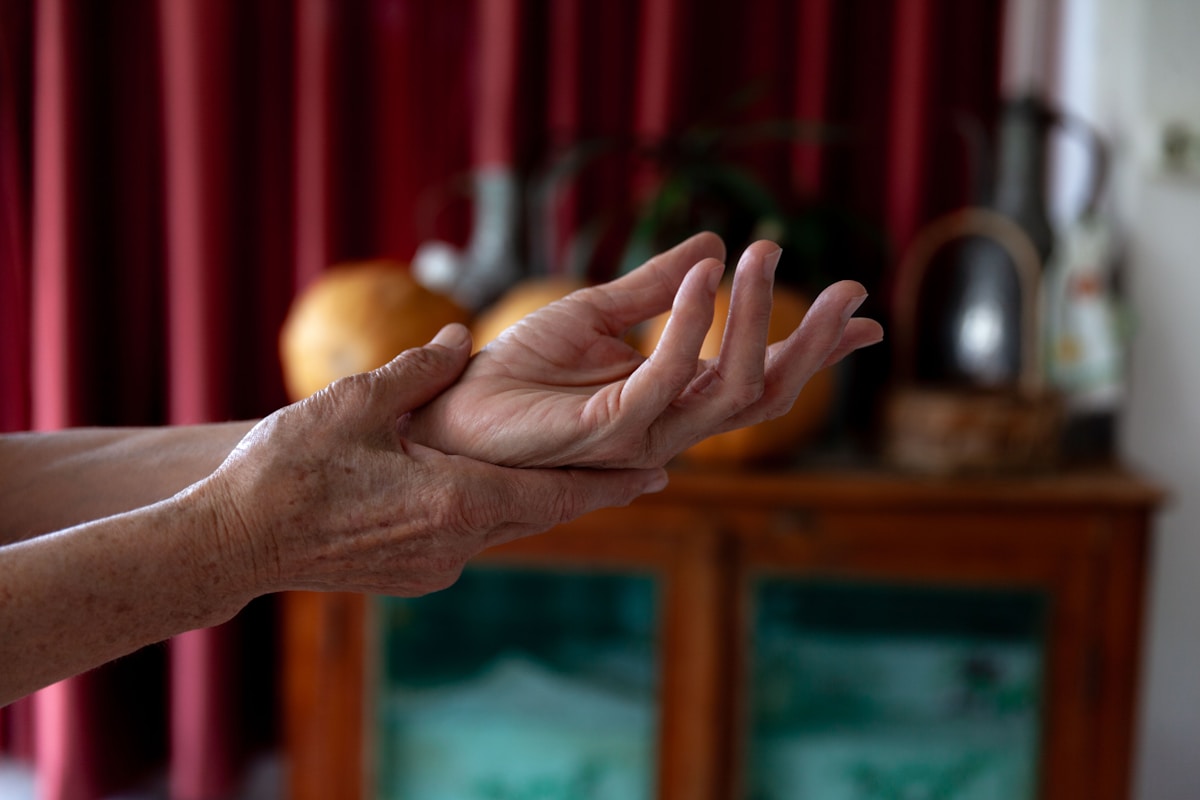 A woman holding out her hands in a living room