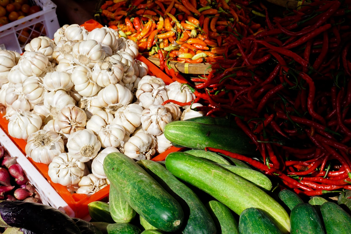 Various fresh produce on display at market.