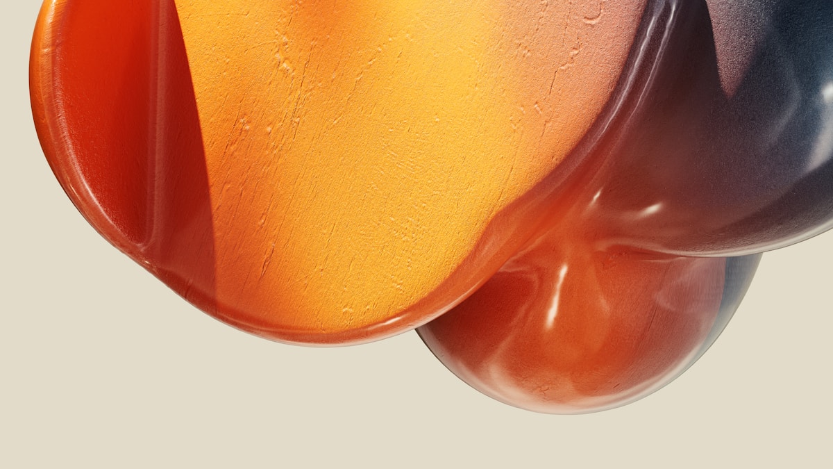 a close up of a colorful object with water droplets